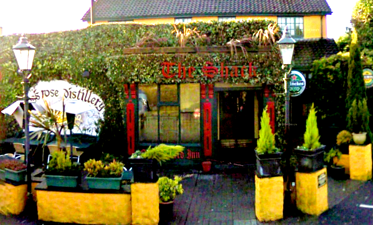 Acoustic musician performing inside The Shack pub.
